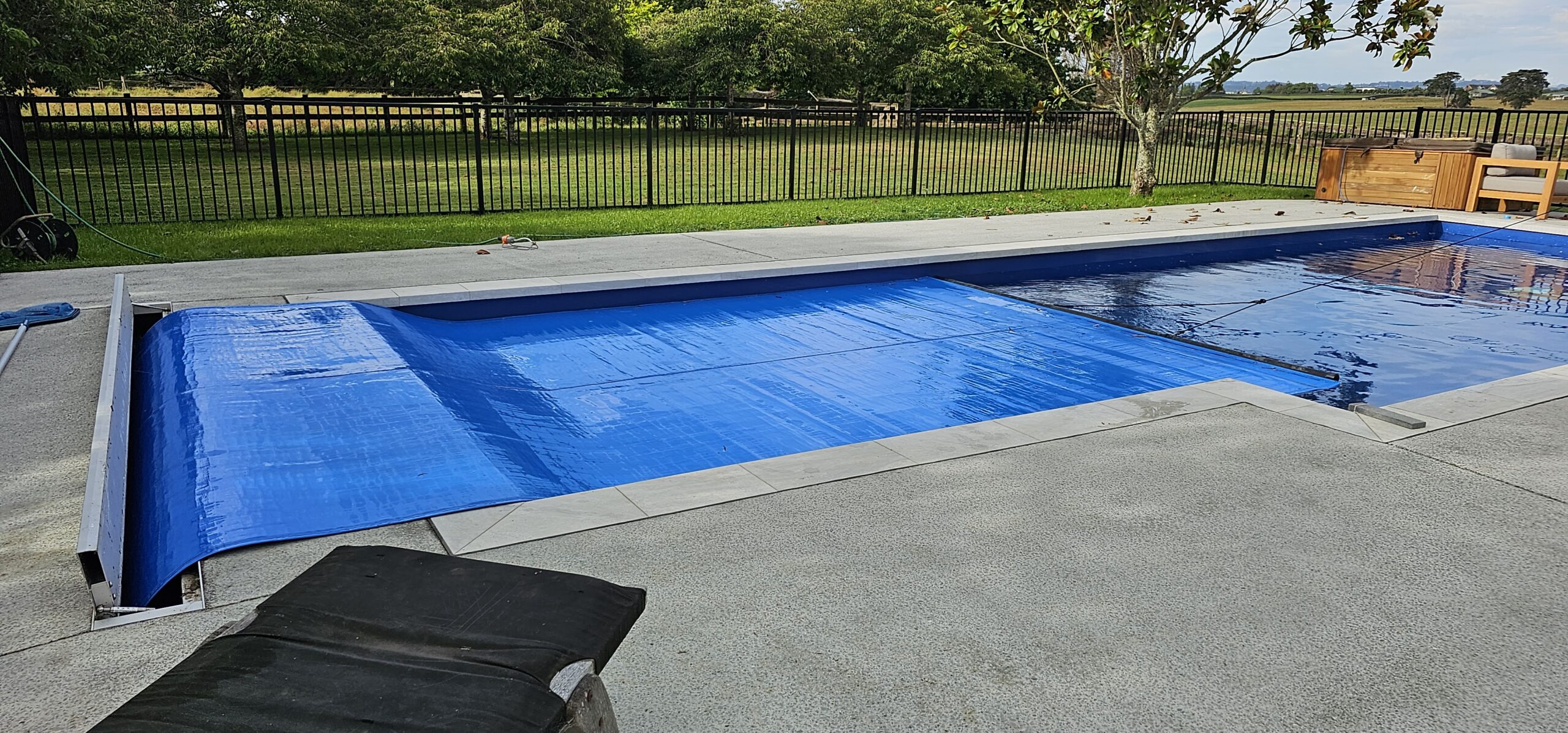 photo of a inground pool cover system for swimming pools